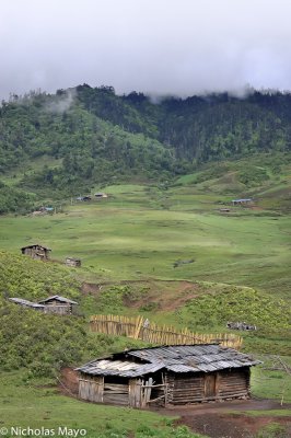 China (Yunnan) - Log Huts In The High Meadows