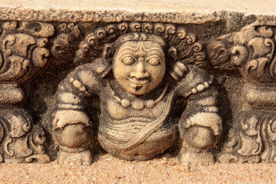 One of many Dwarves supporting steps above the Moonstone of the Queen's Palace (Bisomaligaya) in the sacred city of Anuradhapura