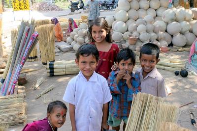 Local children curious about camera touting tourist!