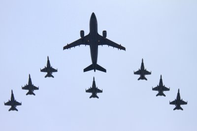 Canadian military aircraft involved in the Libya mission perform a flyby over Parliament Hill