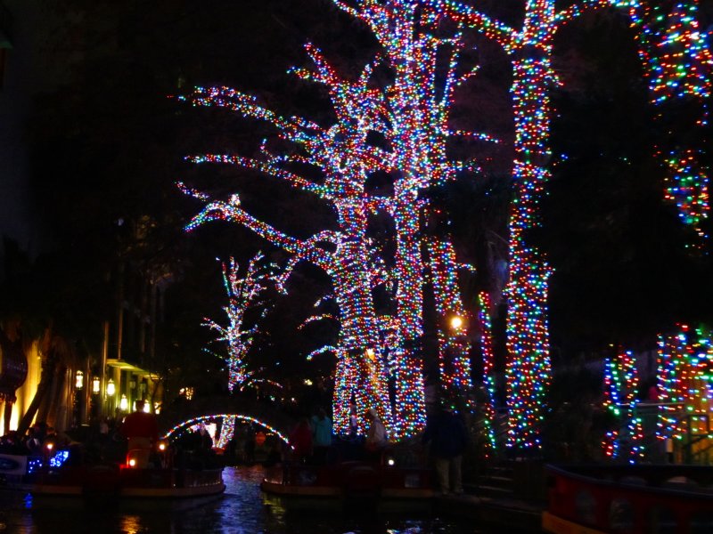 lights along the Riverwalk - taken from a barge