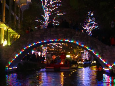 lights along the Riverwalk - taken from a barge