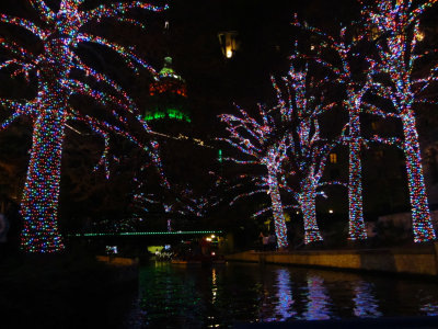 lights along the Riverwalk - taken from a barge