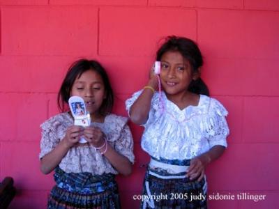 pink wall and cell phones, san andres ixtapa, guatemala