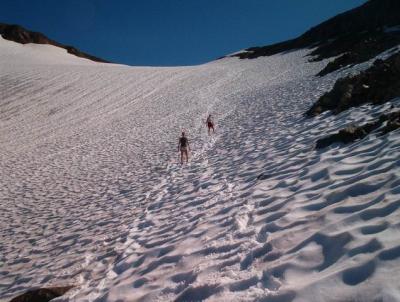 Boot-skiing down from the ridge