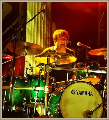 Tom Brechtlein on drums 