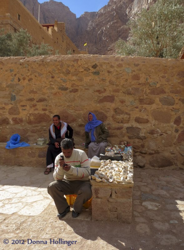 Vendor at St. Catherines Trying Out His Cell Phone