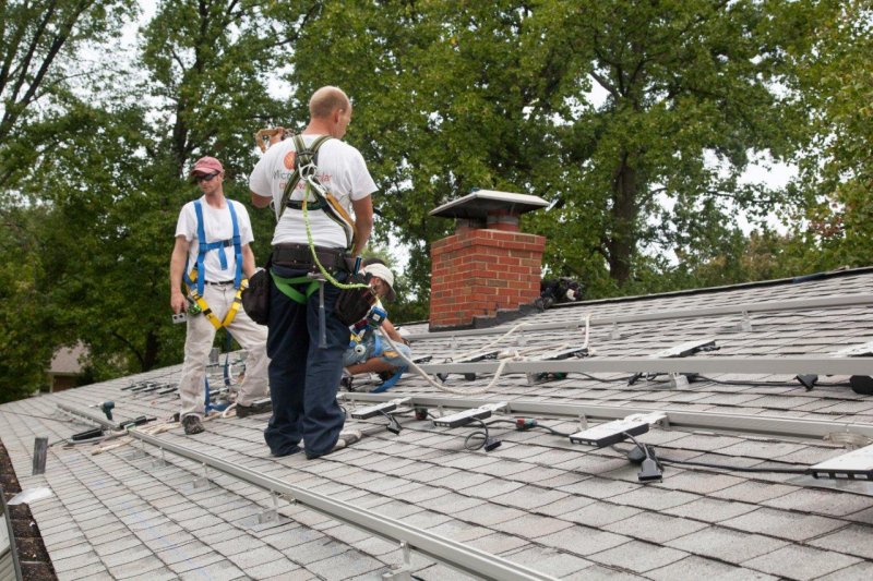 attaching micro inverters to the rails.jpg