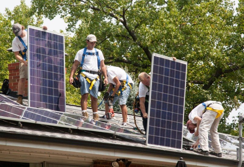 attaching solar panels.jpg