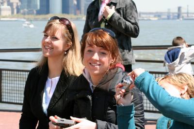 German girls while taking photos of Liberty Statue