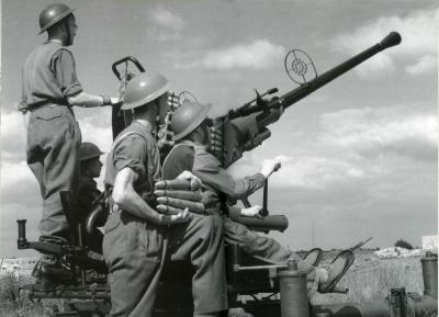 Men Shooting Large Gun p.72-73.jpg