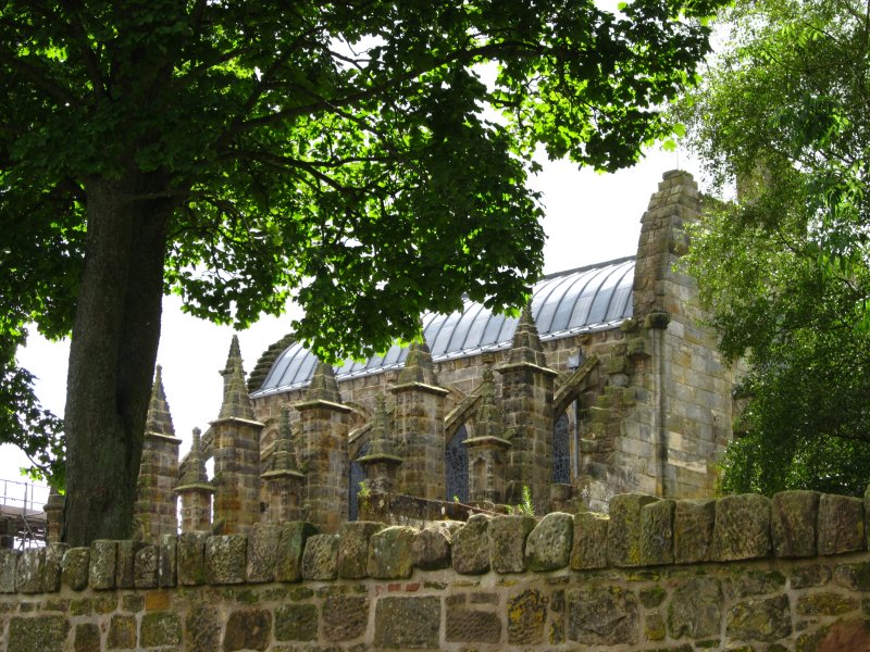 Rosslyn  Chapel , over the wall,largely obscured from sight.