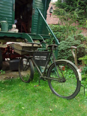 Delivery bicycle beside caravan