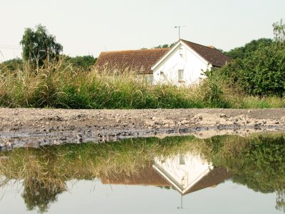 A  reflection  of  a  house  in  Mundon