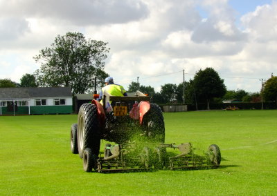 Ken  cutting  the  sports  ground's  grass.