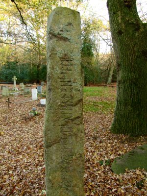 The  standing  stone  with  Runic  script.