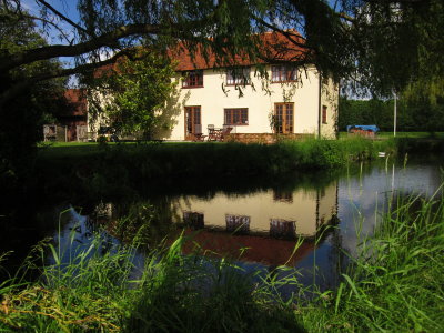 Cesslands  Farmhouse  reflected  in  the  moat.