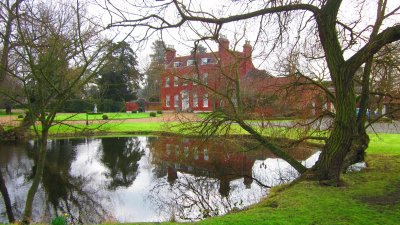 The  Old  Rectory  reflected  in  it's  pond.
