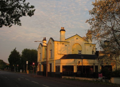 The  Maypole  pub., 'neath  a  mottled  sky.