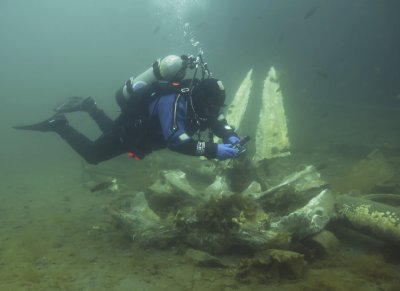 Hugh giving perspective to a whale jaw bone.. Diving the Whale Bones at South Dildo