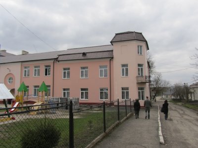 walking by the former Judenrat building with Ihor and the museum docent...