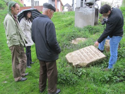 reviewing a set of Jewish gravestones outside the cemeteries, found by Mr. Vorobets and Ihor