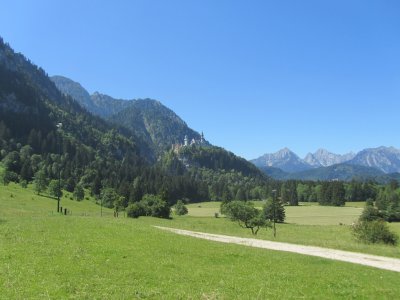 Neuschwanstein and its gatehouse seen from up the valley