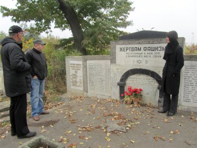 elsewhere in the cemetery, Mr. Wexler shows us a memorial to victims of a killing at a Soroca bridge