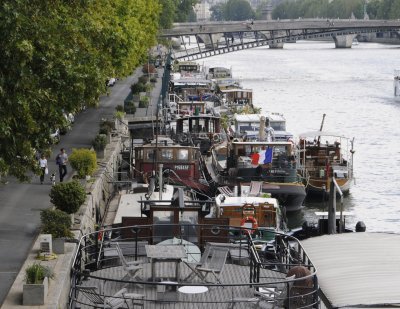 Private boats docked along the Seine River, Paris