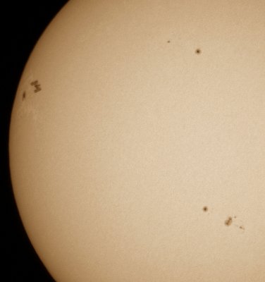 Space station and sunspot 1476
