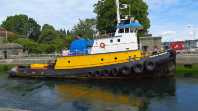Hiram M. Chittenden Locks, Seattle, Washington. Water almost high enough for this Tugboat