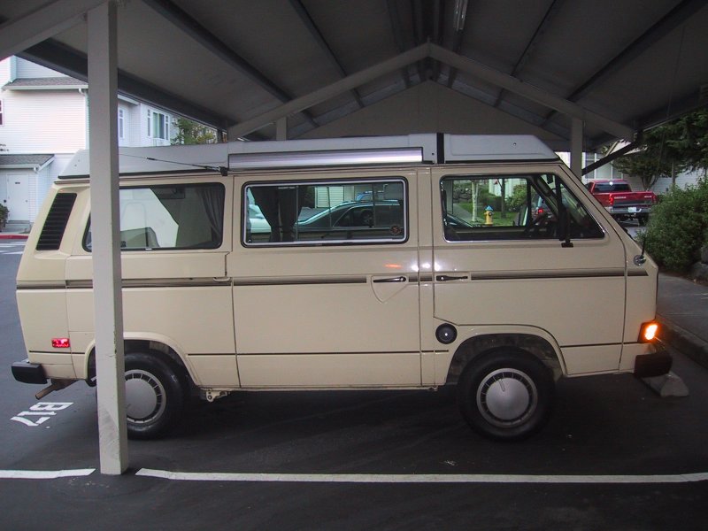 side view of van - CB radio antenna mounted up front above glowing turn signal