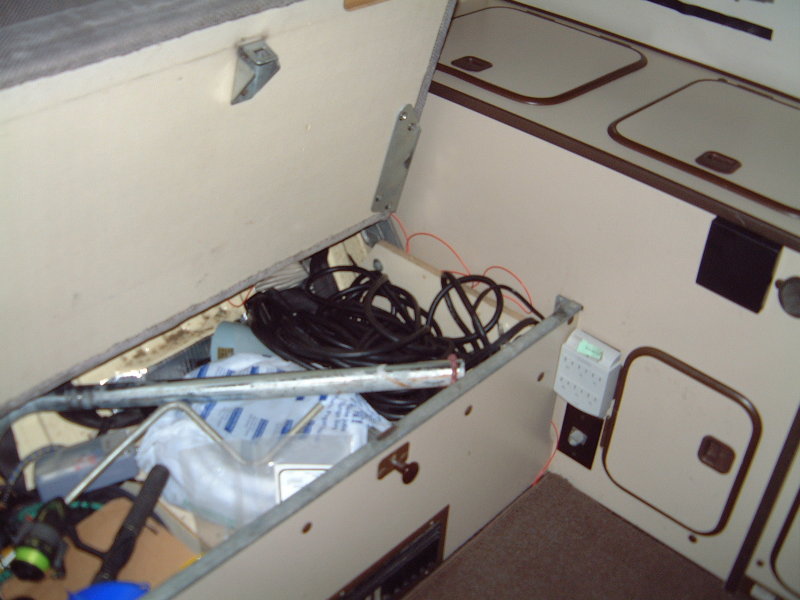 Table leg goes under rear seat