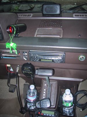 speaker on dash for ham radio, tachometer next to instrument console, CB radio next to shift lever, 2M ham radio on bottom