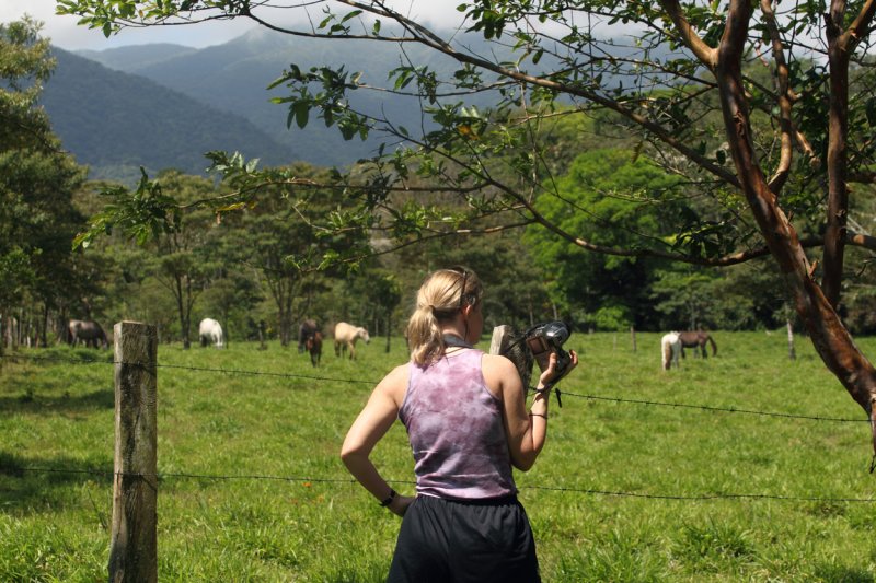 Simone watching horses near Bijagua copy.jpg