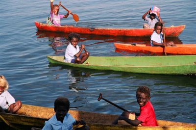 Bright canoes of Viru Harbor..on the way to school