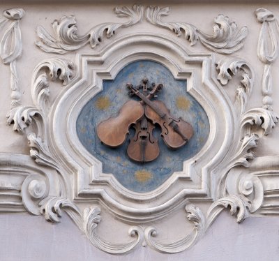 Three violins on Nerudova Street
