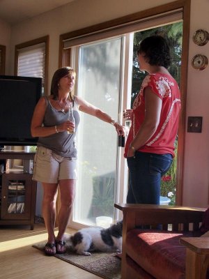 As Cheryl chats with a guest.