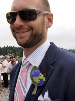The groom tries to smile.