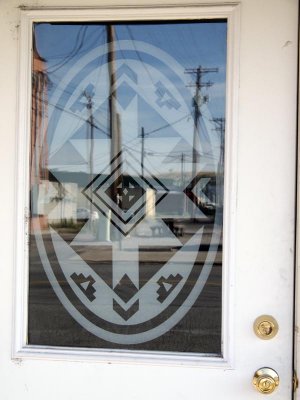 Etched window w/ Indian designs in Polson.