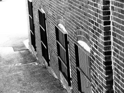 These barred windows are a contrast to the American Flag draped streets.