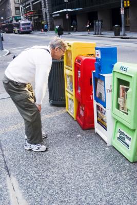 Ron stops to read the local news....