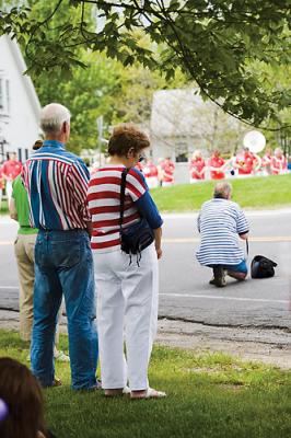 Patriots watch the parade.