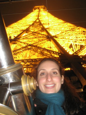 Francine on the 1st floor of the Eiffel Tower at night