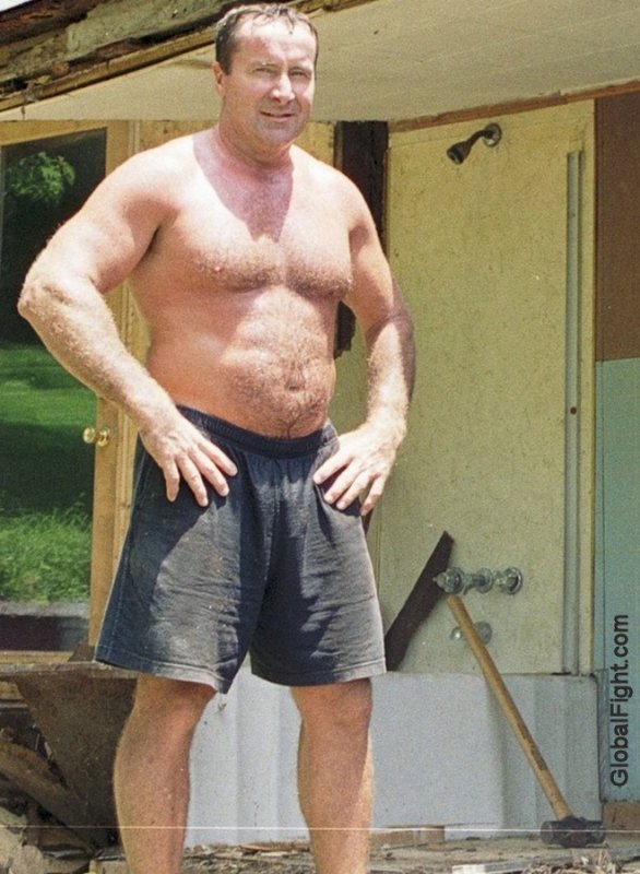man working gym shorts no shirt demolition roofing roofer.jpg