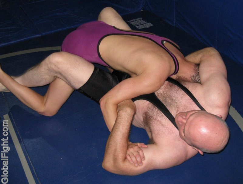 bald daddy wrestling son.jpeg