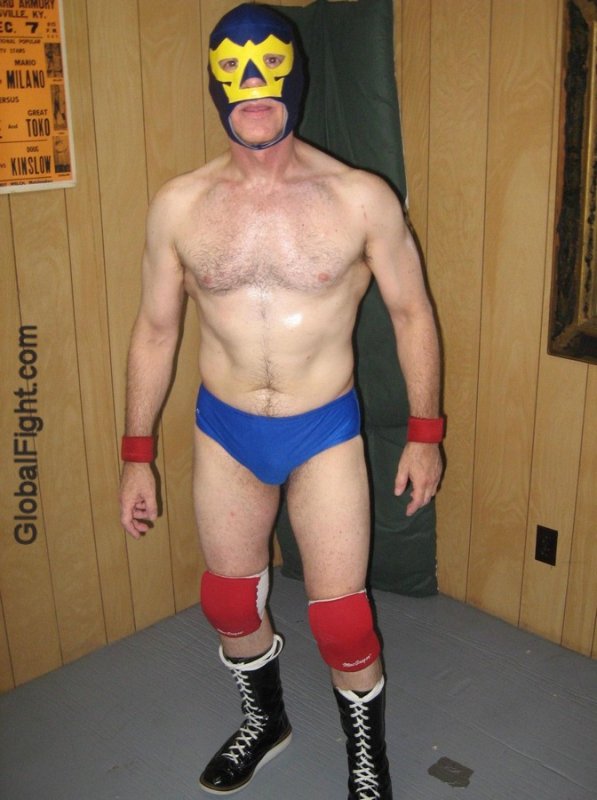 pro wrestler red kneepads blue wrestling trunks.jpg
