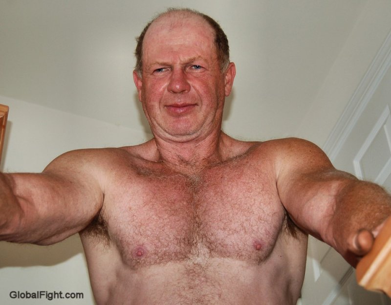 hot grandpa muscular dad flexing big biceps.jpeg