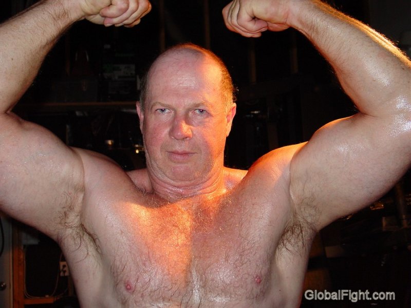 huge muscular bald powerlifter older man.jpeg