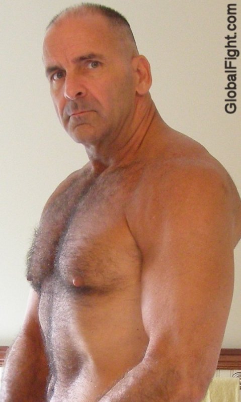 balding hot older gay man flexed muscles.jpg